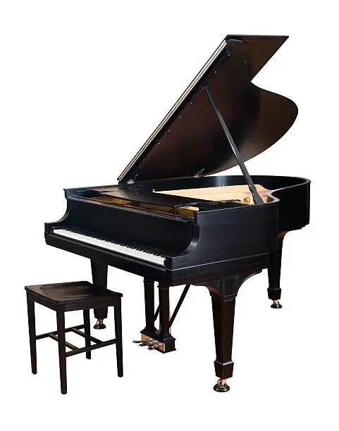 Beautiful parlor sized Steinway grand piano and bench, isolated on white.
