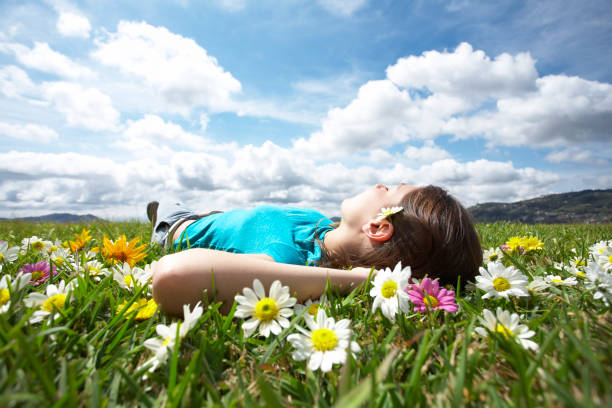 istock Girl resting in meadow 4 157329476