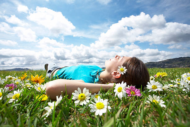 istock Girl resting in meadow 5 157329477