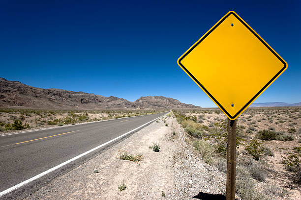 Blank Sign Desert Highway Blank orange road sign in the dry prairie of nevada. Place your own Text. Nevada, USA. nevada photos stock pictures, royalty-free photos & images