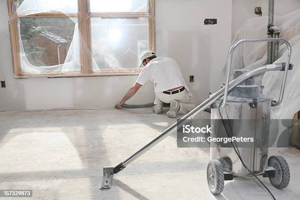 Taper Vacuuming Dust Stock Photo - Download Image Now - Cleaning, Construction Site, Construction Industry