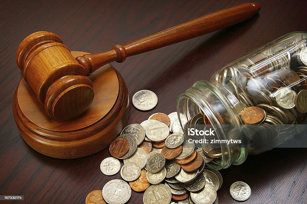 legal coins legal gavel and coins in a coin jar Coin Stock Photo