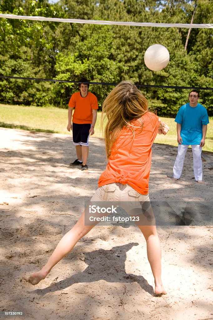 Teenagers playing volleyball in the summer Teenagers playing volleyball.    Volleyball - Sport Stock Photo