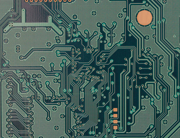 A dull green and complex circuit board stock photo