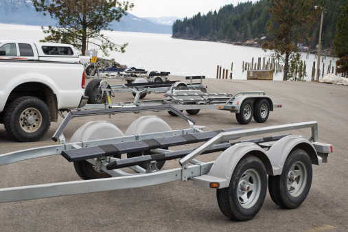 Boat trailers hitched to trucks