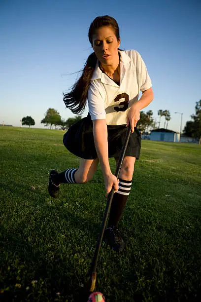 CANON EOS 5D. Female field hockey player running with ball. 