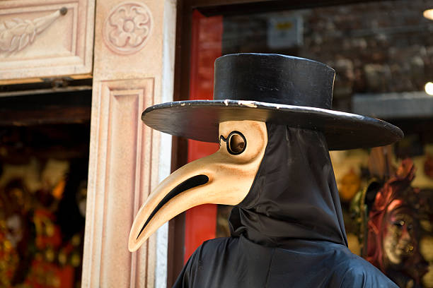 Venice, Italy - March 7, 2011: Two unidentified masked persons costume in St. Mark's Square during the Carnival of Venice. The 2011 carnival was held from February 26th to March 8th
