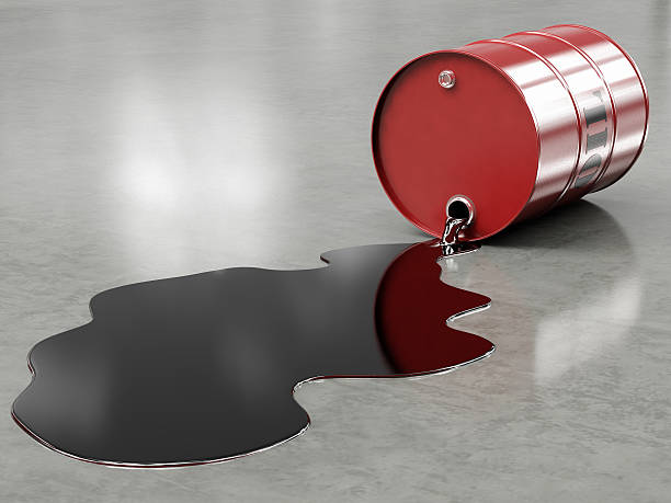 Oil spilling from red barrel onto floor A leaking red oil barrel isolated on a white background. Very high resolution 3D render. drum container stock pictures, royalty-free photos & images