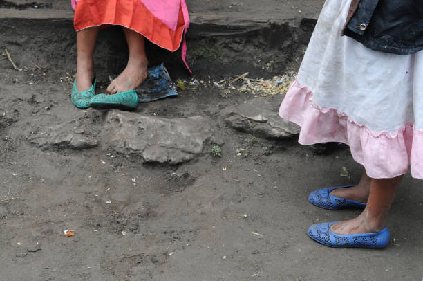 Mom and Daughter Waiting  poverty child ethnic indigenous culture stock pictures, royalty-free photos & images