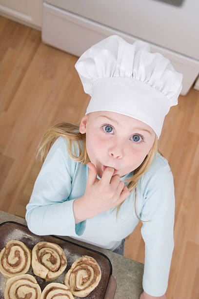 kids baking series - cinnamon buns people bildbanksfoton och bilder