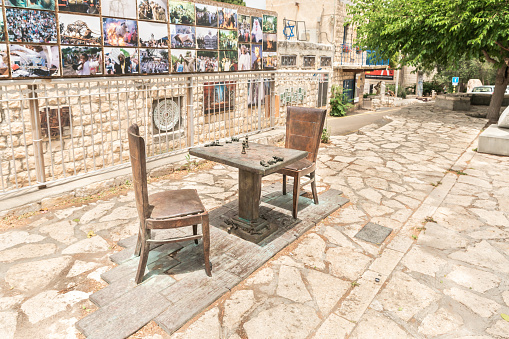 Haifa, Israel, June 03, 2023 : Decorative table with chairs and chess by a local artist in the famous artists village Ein Hod near Haifa in northern Israel