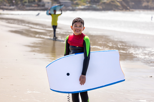 High quality stock photos of a boy bodysurfing at Lindamar beach in Pacifica California.