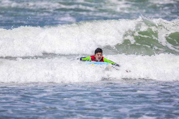 istock Boy Bodysurfing California 1573319040
