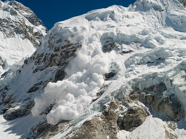 Everest Base Camp Avalanche Avalanche going down form Nupse, just beside Everest Base Camp. avalanche stock pictures, royalty-free photos & images