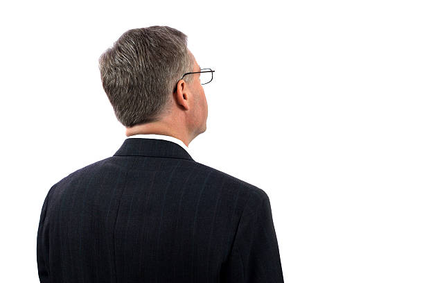 Businessman Looking at Copy Space Rearview of a businessman looking toward copyspace back of head photos stock pictures, royalty-free photos & images