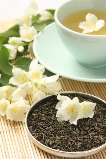 Organic jasmine tea with fresh jasmine flowers.