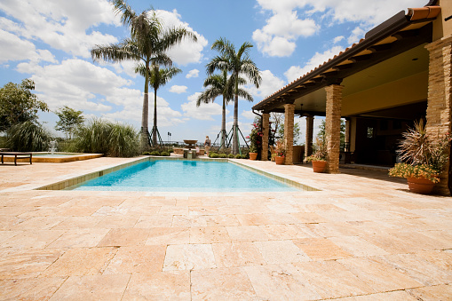 Luxury home with large pool and travertine patio