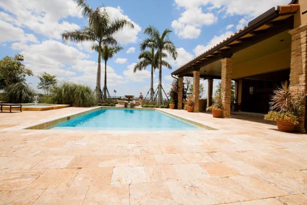 Luxury home with large pool Luxury home with large pool and travertine patio travertine pool photos stock pictures, royalty-free photos & images