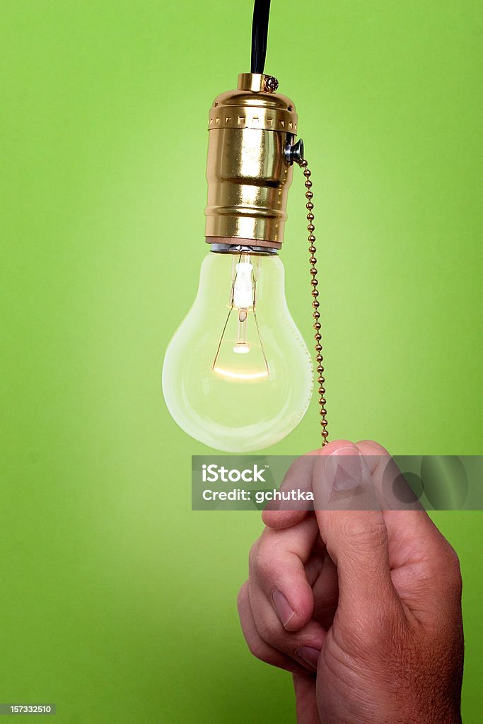 À la lumière de réduction - Photo de Allumer ou éteindre libre de droits