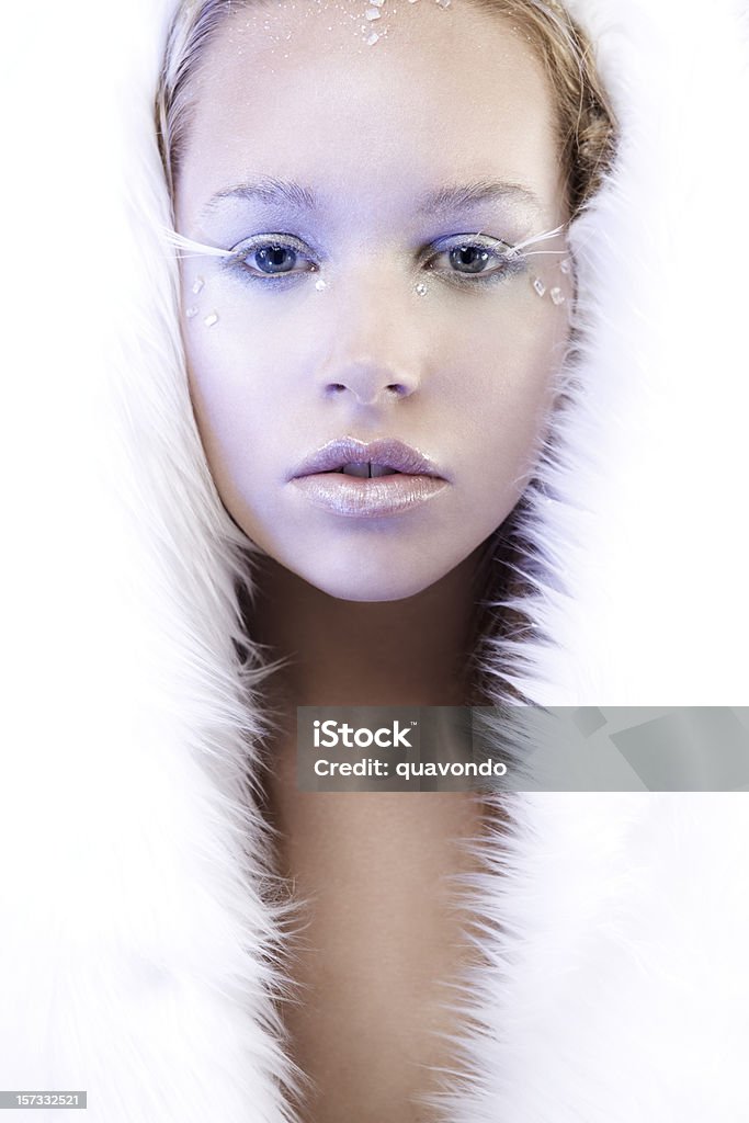 Beautiful Ice Queen in White Fur, Copy Space Gorgeous blond ice queen in white fur, copy space. Snow Maiden Stock Photo