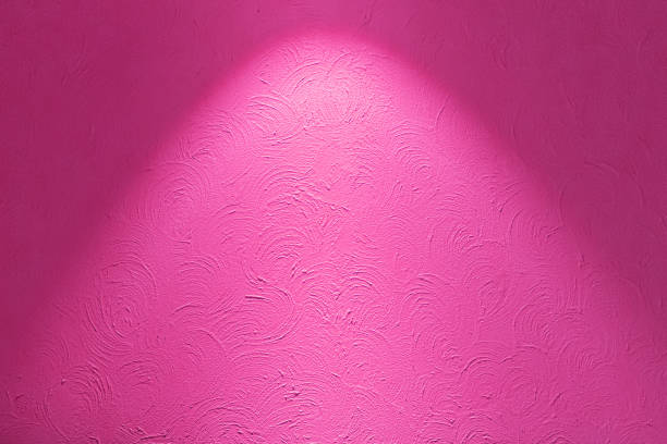 istock Pink and red neon bulbs on white wall. texture background. 1573327034