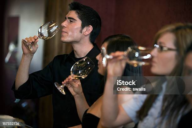 Man And Women Tasting Different Wines Stock Photo - Download Image Now - Tasting, Wine, Adult