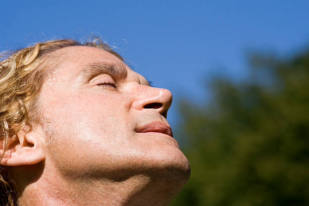 istock Enjoying the warm summer sun on his face 157332831