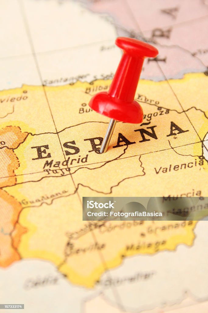 Spain Pushpin pointing Madrid in more than sixty years old map. Shallow depth of field Map Stock Photo