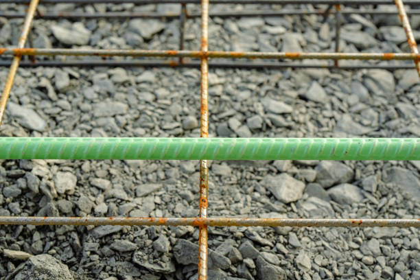Welded wire mesh, WWM, installed within a sidewalk concrete form prior to the installation of concrete.