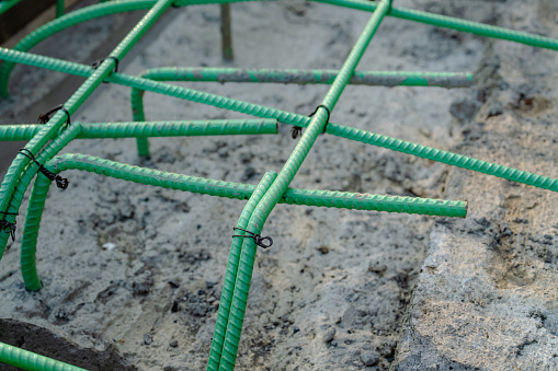 Epoxy coated rebar is used in concrete subjected to corrosive conditions.  These may include exposure to deicing salts or marine environments.