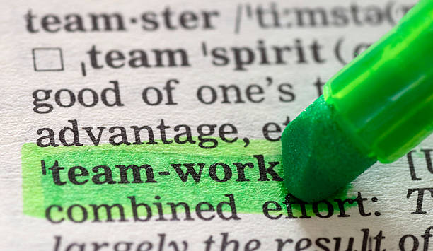 istock teamwork defintion highlighted in dictionary - significance 157333638