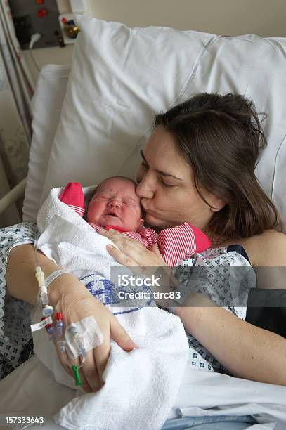 Mother Kissing Newborn Stock Photo - Download Image Now - Adult, Baby - Human Age, Baby Girls