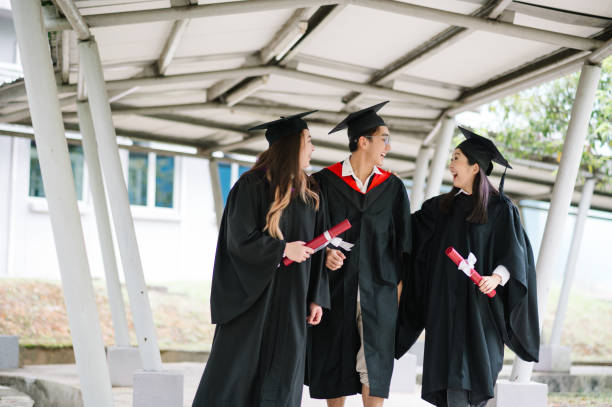 istock Happy Asia student walking on school corridor. 1573336480