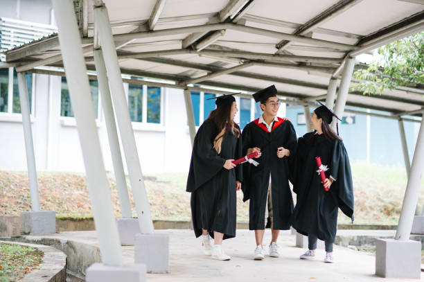 istock Happy Asia student walking on school corridor. 1573336482