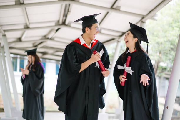 istock Happy Asia student walking on school corridor. 1573338535