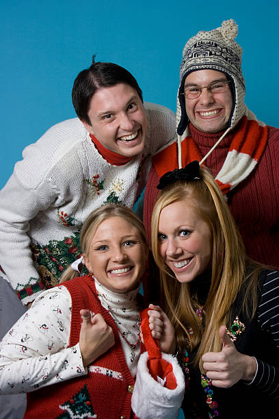 Christmas Nerds Group A group of Christmas nerds wearing holiday sweaters. christmas ugliness sweater nerd stock pictures, royalty-free photos & images
