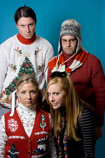 Holiday Nerds Again Christmas nerds wearing their ugly sweaters. christmas ugliness sweater nerd stock pictures, royalty-free photos & images