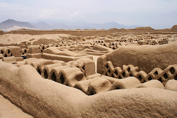 Adobe Walls, Chimu culture Panoramic view of Chan Chan ruins. Pre-columbian adobe city located outside  Trujillo. trujillo peru stock pictures, royalty-free photos & images