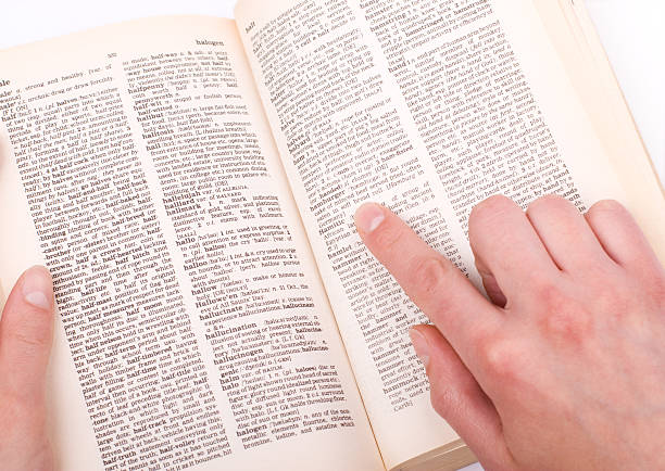 istock Finger pointing to word in a book 157334146