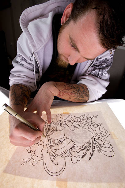 istock Tattoo Artist Tracing Design 157334197