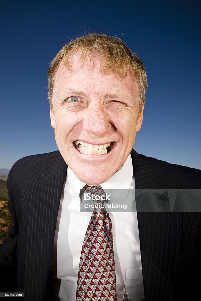 Serrare i denti Uomo d'affari - Foto stock royalty-free di 55-59 anni
