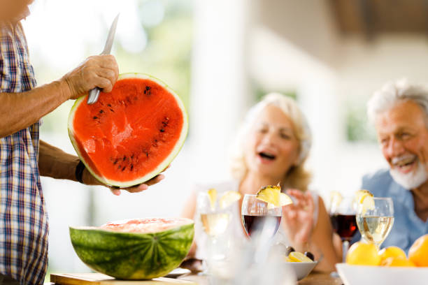 istock Close up of cutting fresh watermelon for snack. 1573343691