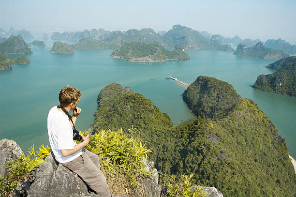 Male Photographer Looking At A View Of Halong Bay, Vietnam  haiphong province photos stock pictures, royalty-free photos & images