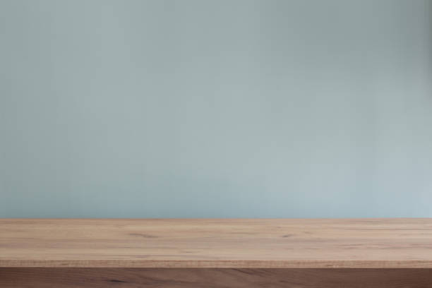 istock background with modern wooden table and blue  wall 1573345266
