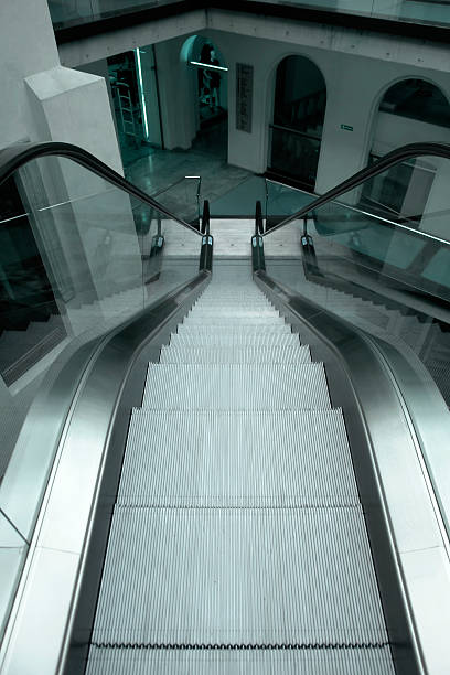 istock Department Store, Shoping Centre interior with escalator, light cyan toned 157335479