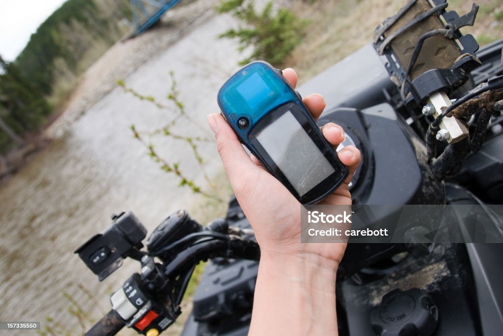 Quad and GPS Series A woman holding a gps device. 4x4 Stock Photo