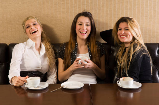 istock happy girls in cafe 157335641