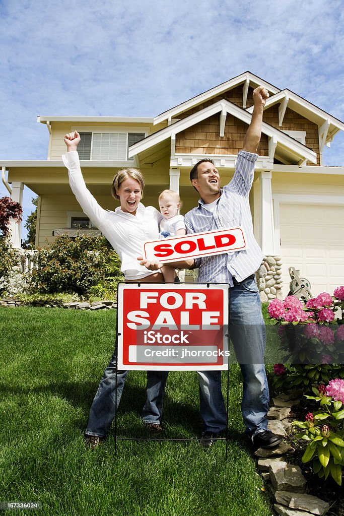 Family with Sold Home  Selling Stock Photo