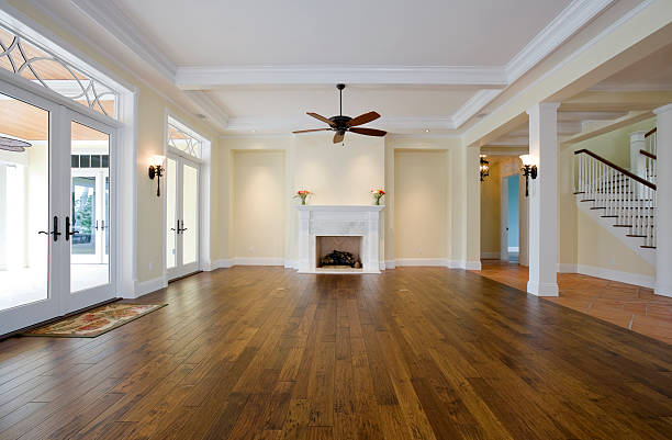 Living Room with No Furniture and Wooden Floors Beautiful living room ready to filled with furniture in this estate home. hardwood floor stock pictures, royalty-free photos & images