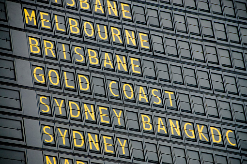 Departure board showing Australian destinations.